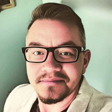 Headshot of Gus Raymond